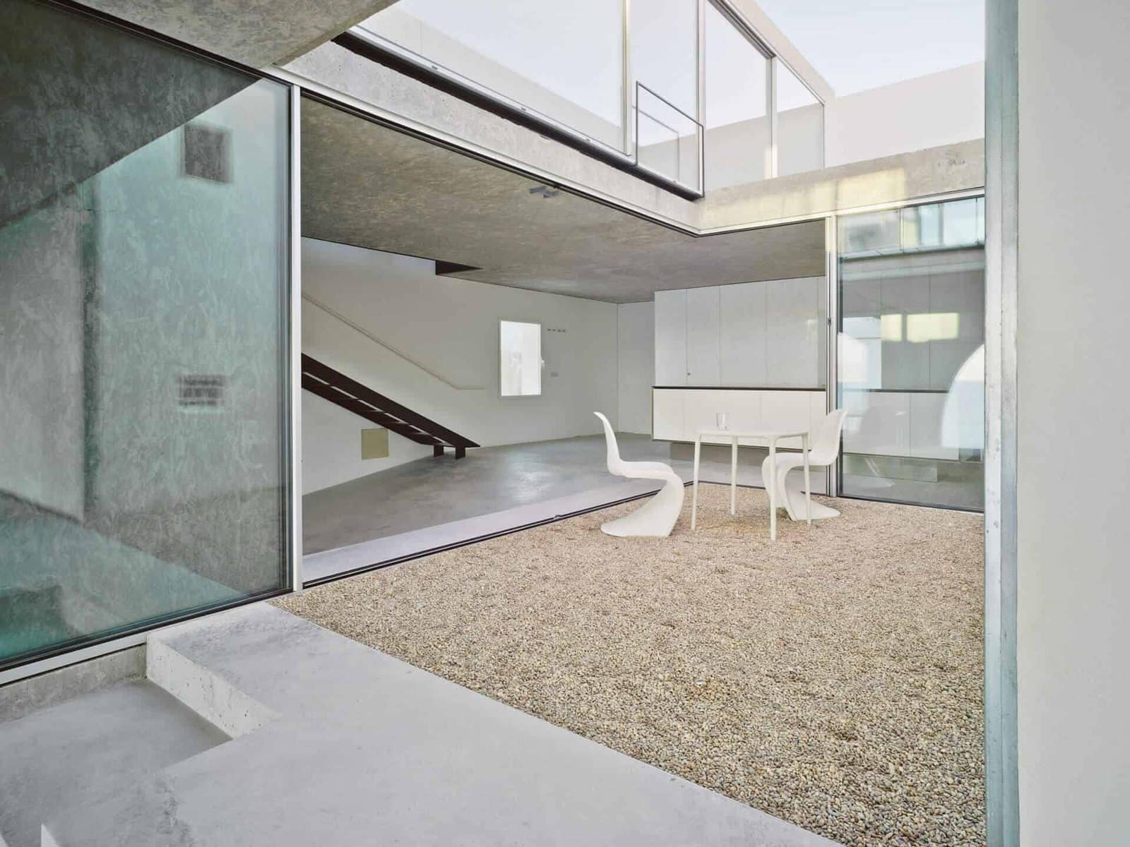 A Cortizo COR Vision slider opening onto a walled courtyard