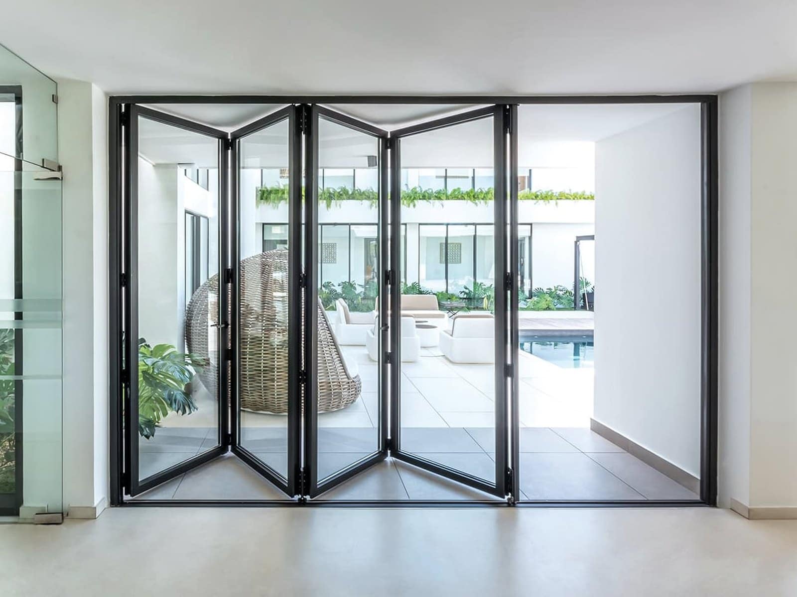 A Cortizo bifolding run folded fully open across an interior opening